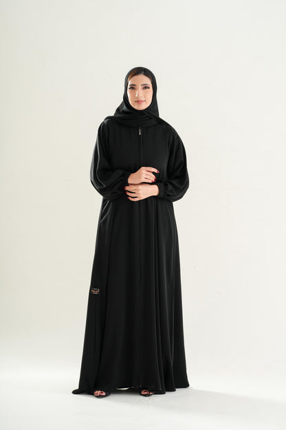 Premium Umrah Abaya Model U103 with full front zipper and elastic sleeves in black, made in UAE