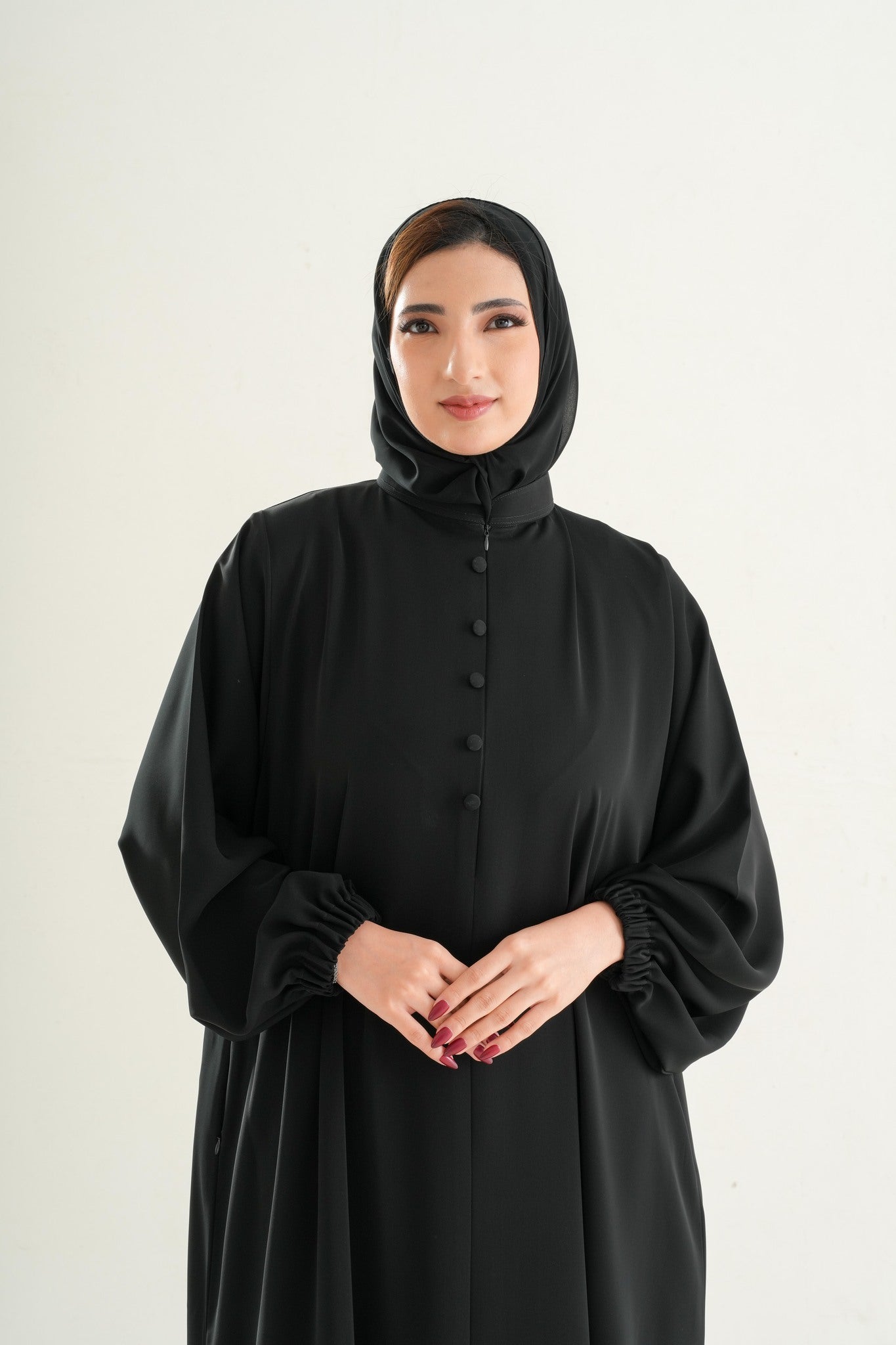 Premium Umrah & Hajj Abaya Model U102 with high neck and semi front zipper in black, made in UAE